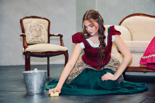 Cinderella washing floors.